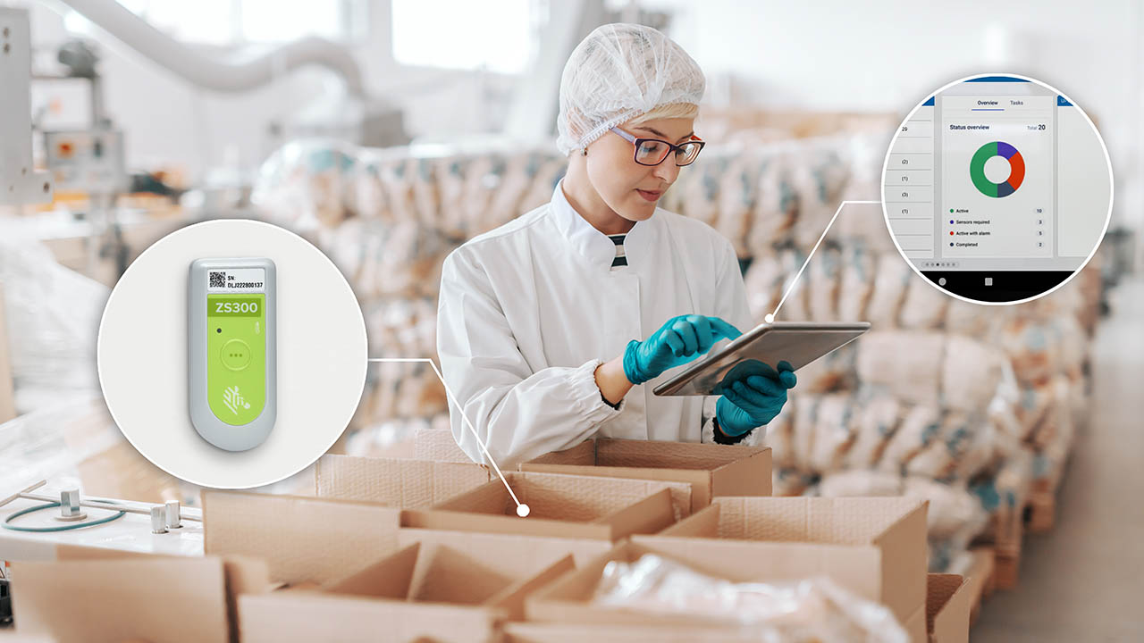 A cold chain quality inspector confirms that boxed inventory is within acceptable range by referring to data reported by a Zebra enviromental sensor on her tablet.